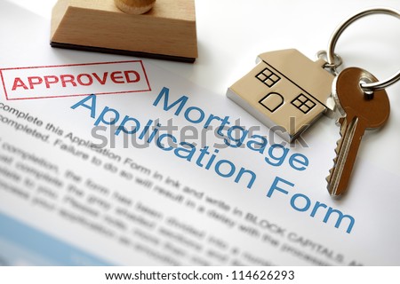 Approved Mortgage loan application with house key and rubber stamp Royalty-Free Stock Photo #114626293