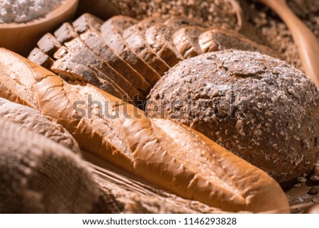 Whole wheat bread and oat on wood table.Copy space.