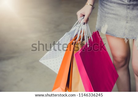 hand on holding shopping bags , she walking shopping