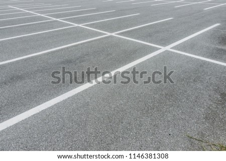 Empty car parking lot at city center, Vacant Parking Lot, Parking lane painting on floor, copy space