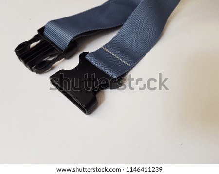 Nylon belt strap and buckle lock on white background.