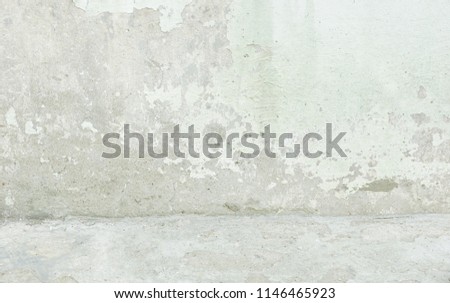 the old cement wall stucco texture background exterior wall and floor bright white beautiful crack. rain water stains