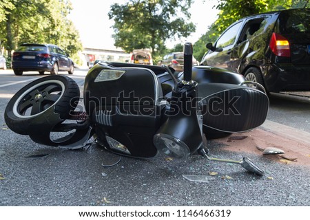 road accident with motor scooter Royalty-Free Stock Photo #1146466319