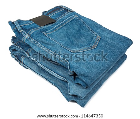 Stack of blue jeans a white background