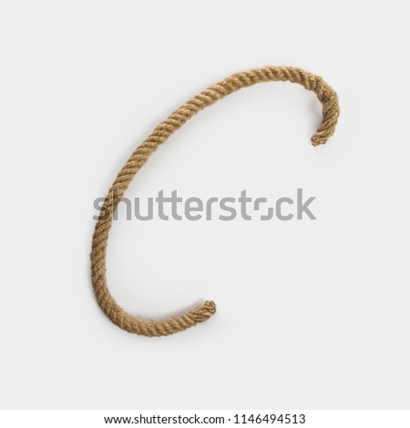 C letter written with a rope  isolated on white background