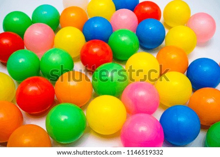 colorful plastic balls on a white background