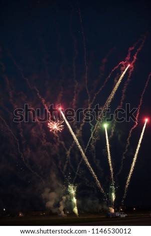 Multicolor fireworks celebration. Color red, green and gold sparks in the sky