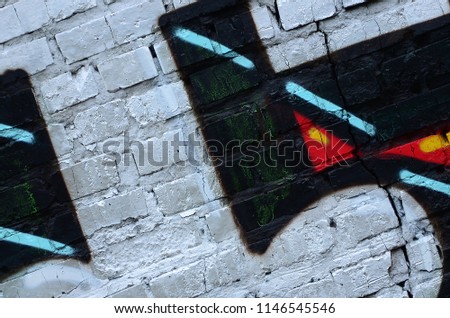 Street art. Abstract background image of a fragment of a colored graffiti painting in chrome and red tones