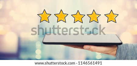 Five Star Rating with man holding a tablet computer