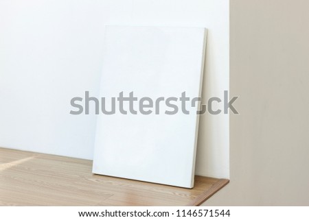 white canvas on the white wall