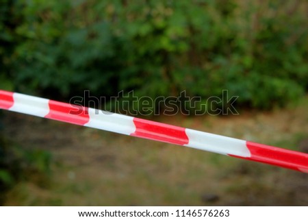 Red and white lines of barrier fencing tape. Fencing red and white tape, which prohibits movement. Warning tape. Barrier red and white ribbon. Access denied line, do not enter hazardous area.