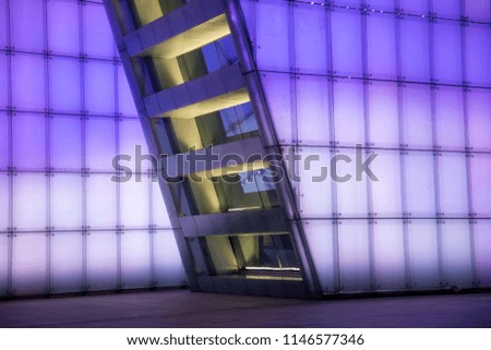 Abstract fragment of modern architecture, walls made of glass and led.