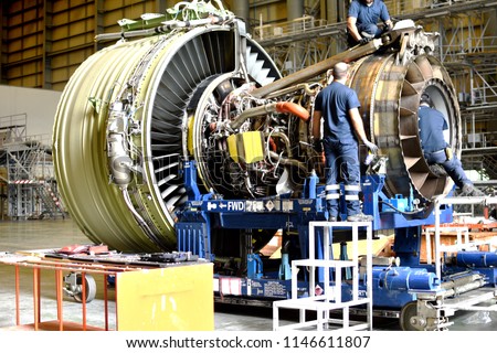 Jet engine remove from aircraft (airplane) for maintenance at aircraft hangar.Jet engine maintenance and change part by aircraft technician . Royalty-Free Stock Photo #1146611807