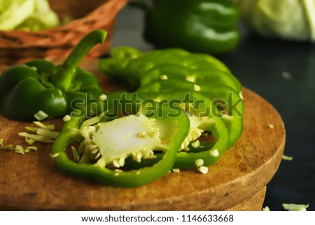 Cross Section and sliced Green Capsicum on the wooden backdrops Royalty free Stock Photos and Images

