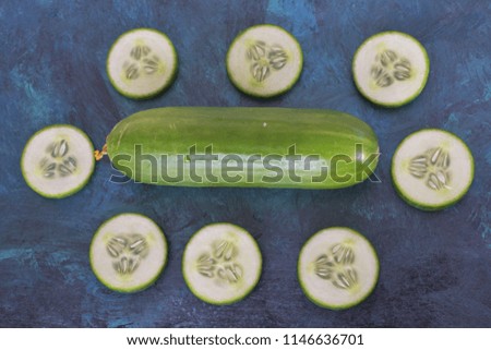 Mixed and sliced Cucumber on the wooden background Royalty free Stock Photos and Images
