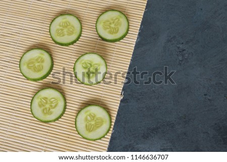 Mixed and sliced Cucumber on the wooden background Royalty free Stock Photos and Images
