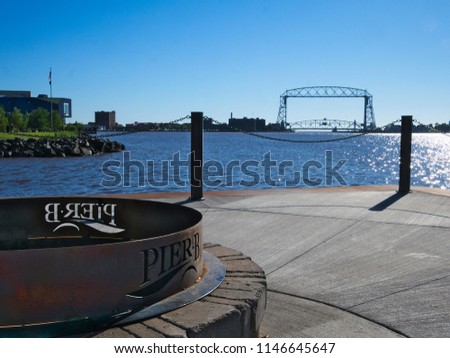 Duluth Minnesota aerial lift bridge with fire pit in foreground on a sunny morning