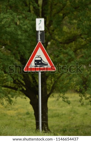 Traffic indicator, train attention -Road sign used in Germany - rail road crossing without barrier.
