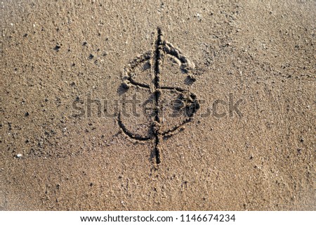Currency dollar mark icon drawn on the beach deleting part 1