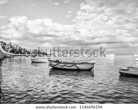 Boats on a beach. Beach landscape with beautiful clouds. The image is of the Mar Menor in Cartagena, Region of Murcia. Spain