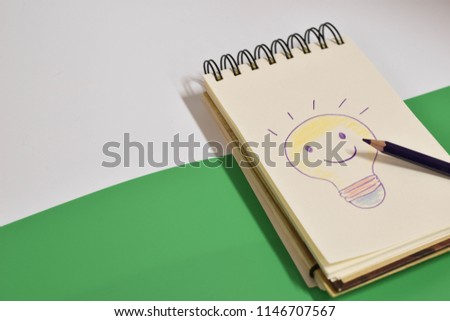 The light bulb was drawn by a wooden pencil on a notebook.
It is a symbol of sparking ideas.