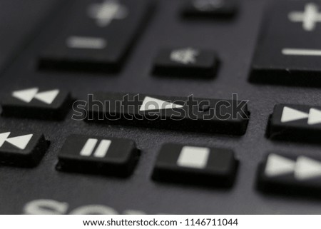 Close up macro of the TV remote control. Selected focus on play button