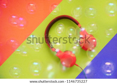 Headphones on a colorful background.