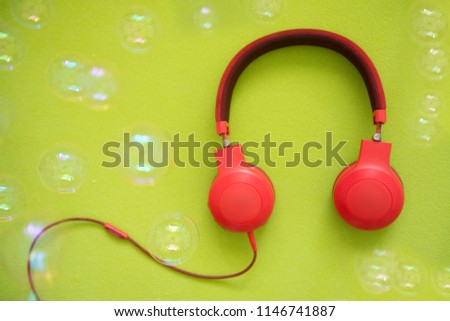 Headphones on a colorful background.