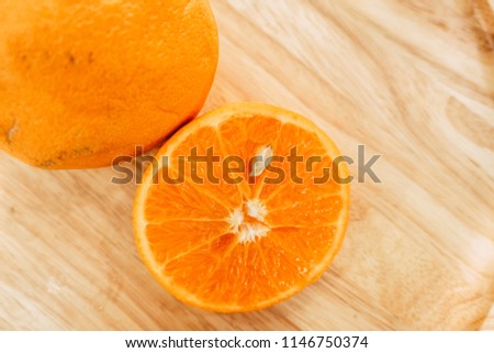 orange fruit slice on wooden table background