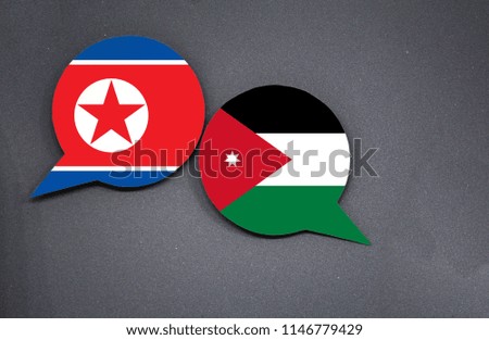 North Korea and Jordan flags with two speech bubbles on dark gray background