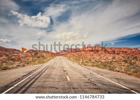 Vintage toned picture of scenic road in Arizona, travel concept, USA.