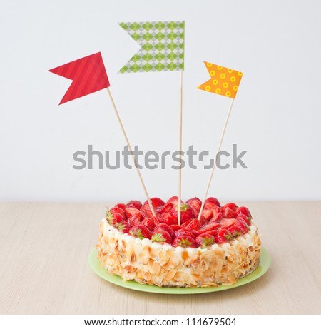 Sweet cake with decorations on a table Royalty-Free Stock Photo #114679504