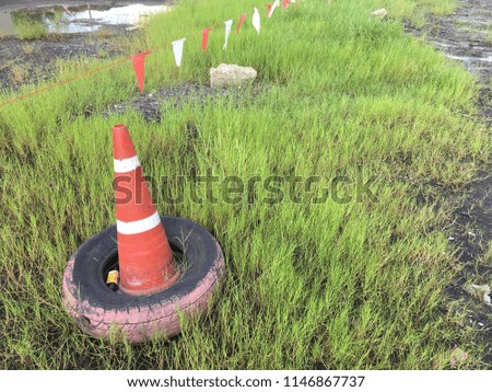 traffic sign cone on green grass