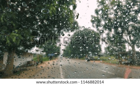 Rain water on the glass car. View through the car window.