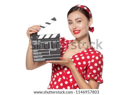 Woman with movie clapper board. Young retro pin-up girl