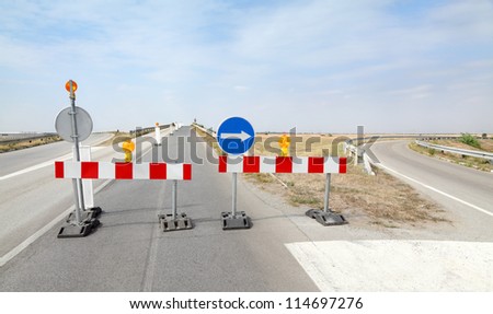 Roadworks, road signs in a highway on reconstruction