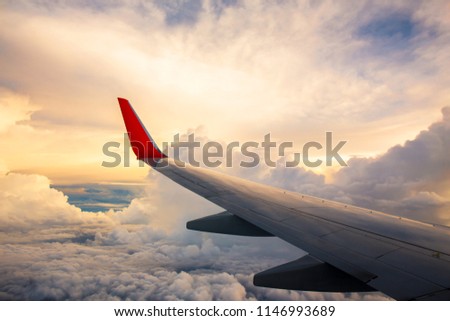 Morning sunrise with Wing of an airplane. Photo applied to tourism operators. picture for add text message or art work frame website. Traveling concept.