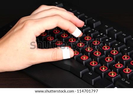 Painful typing on keyboard close-up