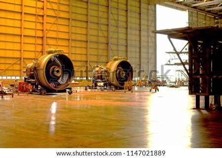 Two jet engine remove from aircraft (airplane) for maintenance at aircraft hangar.Jet engine maintenance and change part by aircraft technician .