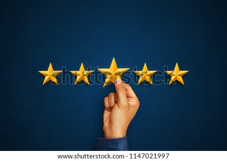 Hand of client giving a five star rating. Service rating, satisfaction concept Royalty-Free Stock Photo #1147021997