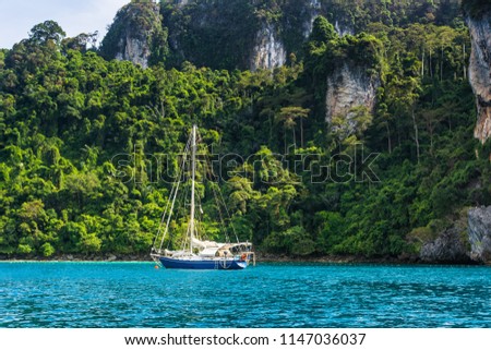 Yacht in beautiful bay near Koh Phi Phi Don in Andaman sea. Location: island Koh Phi Phi Don, Krabi, South Thailand. Artistic picture. Beauty world.