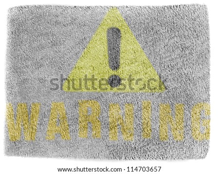 Warning sign painted on grey towel