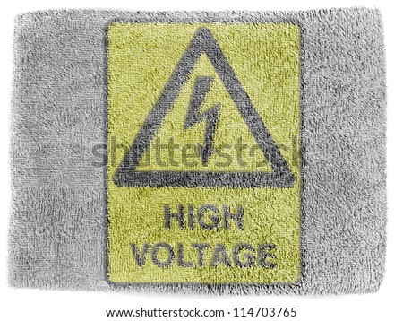 High voltage sign drawn at grey towel