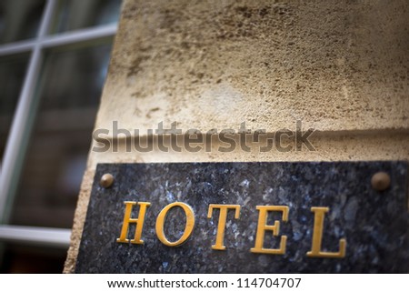 Marble plaque on the facade of a hotel