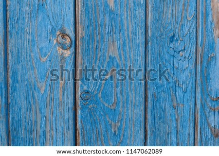 Blue wooden wall. Old shabby wooden planks with cracked color paint. Background. Texture wood.