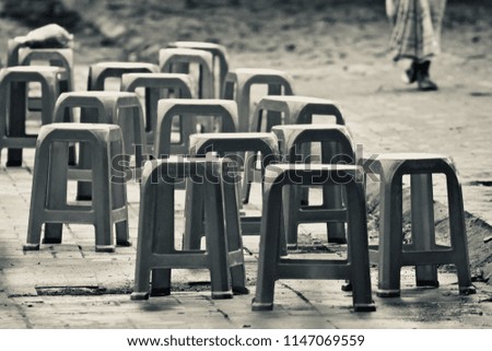 Beautiful black and white plastic chairs isolated unique photograph