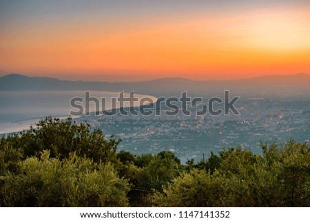 Amazing sunset over Kalamata city. Aerial view from Taigetus mountain. Kalamata is the capital and the biggest city of Messenia, Greece and has become a top tourist destination in Greece, Europe.
