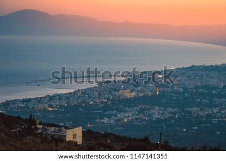 Amazing sunset over Kalamata city. Aerial view from Taigetus mountain. Kalamata is the capital and the biggest city of Messenia, Greece and has become a top tourist destination in Greece, Europe.