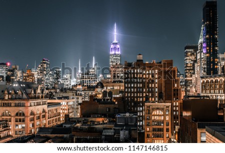 long exposure of the manhattan skyline from a rooftop