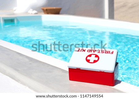 First aid kit near swimming pool. Concept